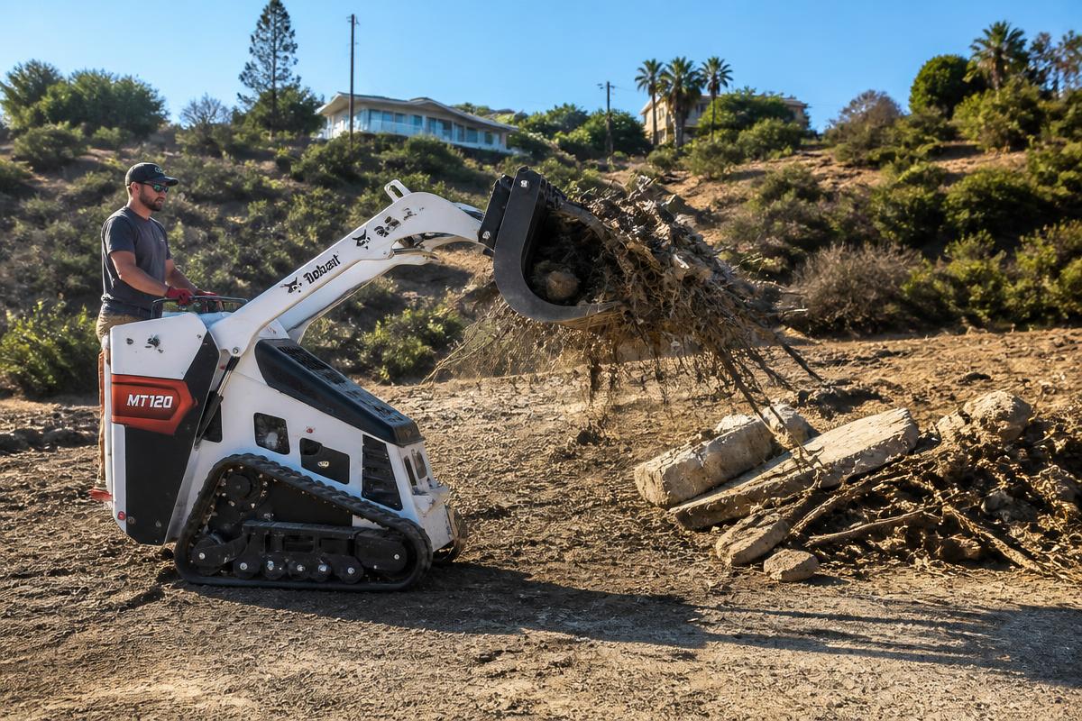 Bobcat MT120 with brush grapple clearing overgrown vegetation on a hillside lot